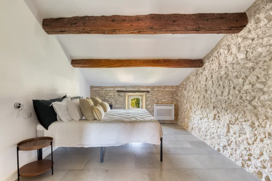 A bedroom with old oak beams
